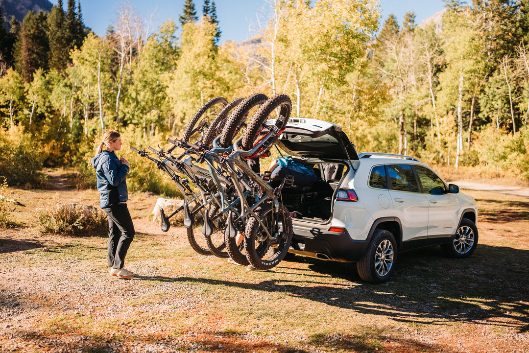 4 hitch bike rack with SUV trunk open 