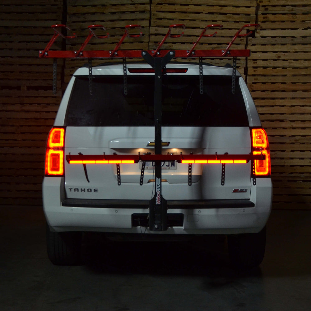 Illuminated light bar on back of a Chevy Tahoe.